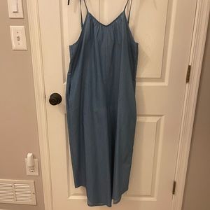 Blue jumper. Adjustable straps, light jeans material. Cropped. Really cute on